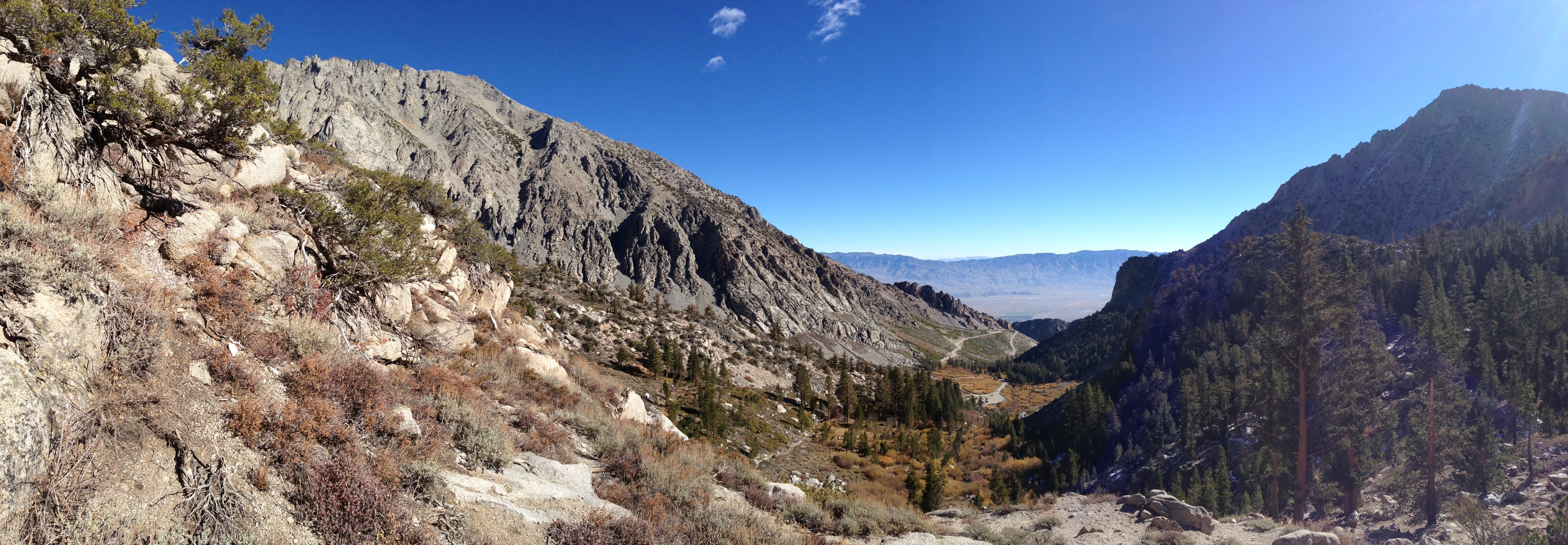 Mountain valley landscape under a clear blue sky